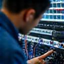 Technician performing signal tests