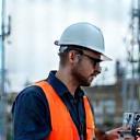 Engineer analyzing signal strength on-site